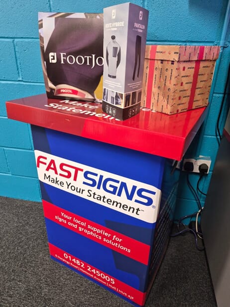 An image of the FASTSIGNS podium with tabletop signage on top.